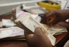 image of the Nigerian Naira banknotes being counted by hand