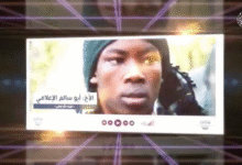 A different picture of Abu Salim in the JAS video wearing a similar green scarf.