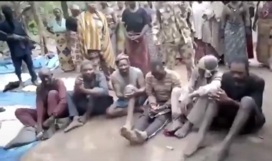 Screenshots from the 2023 footage showing the abducted victims and armed men surrounding them