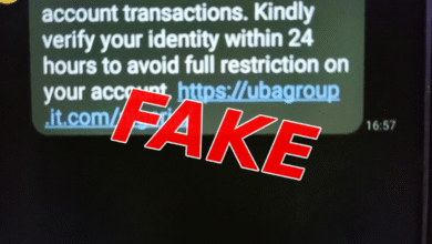 A screenshot of a suspicious UBA text message urging the recipient to verify their identity within 24 hours through a linked website, overlaid with the word “FAKE” in large, bold, red lettering.