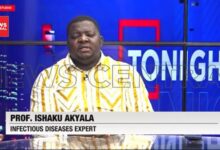 rof. Ishaku Akyala, an infectious diseases expert, wearing a yellow-and-white patterned traditional outfit while seated in the News Central television studio.