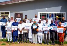 Project Sauti Civic Audio Leads pose with certificates and campaign messages after completing a FactCheckAfrica training workshop in Ilorin.