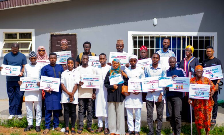 Project Sauti Civic Audio Leads pose with certificates and campaign messages after completing a FactCheckAfrica training workshop in Ilorin.